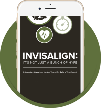 Preview of our FREE Invisalign ebook displayed on an iPhone.